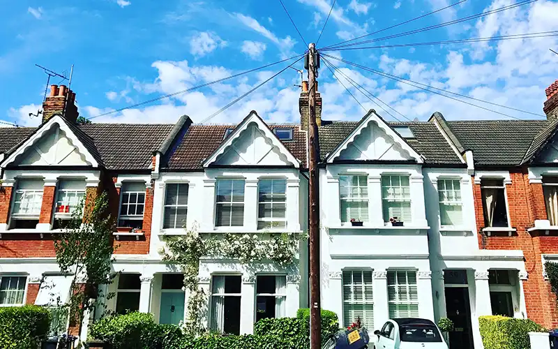 low-angle-view-houses-against-sky
